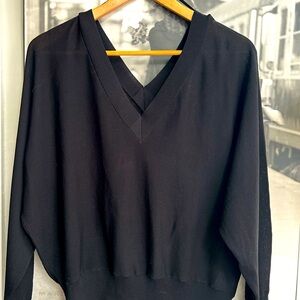 Elegant oversized black v-neck/back lite sweater.